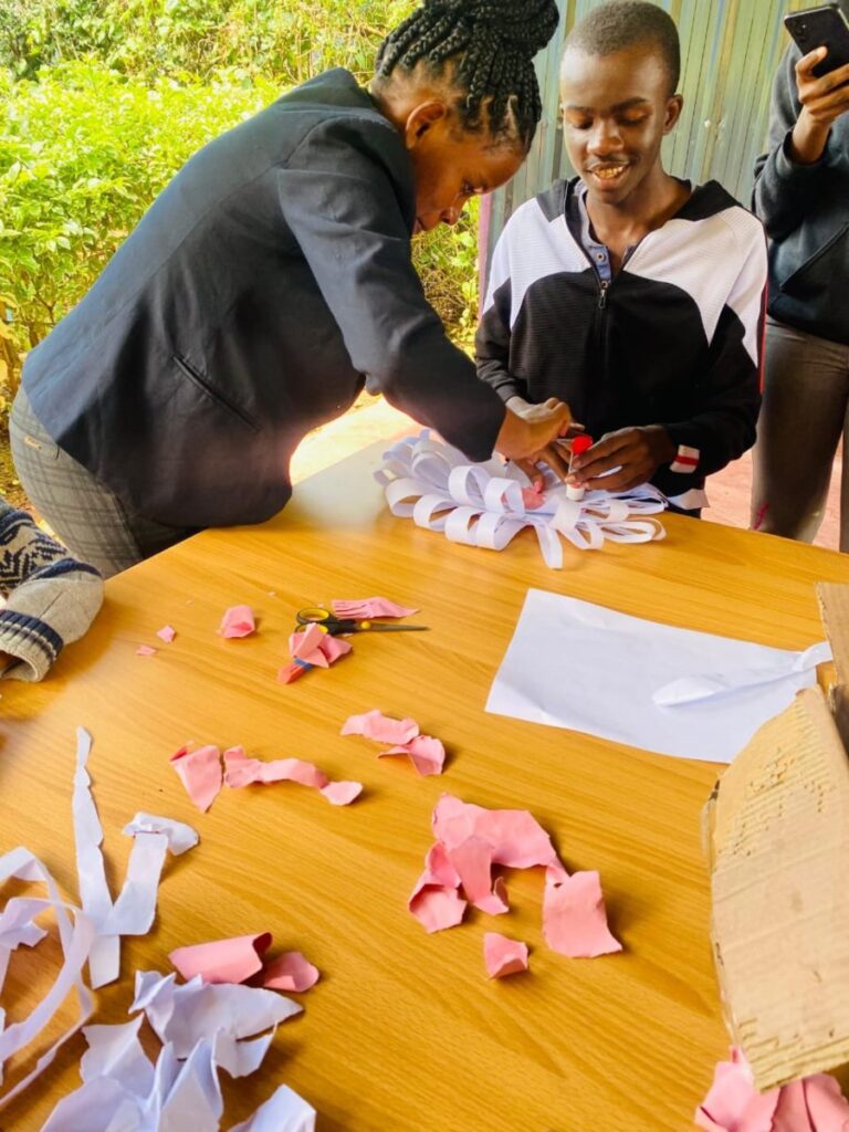 Child participating in art and sensory activity at Holmeside School Nairobi