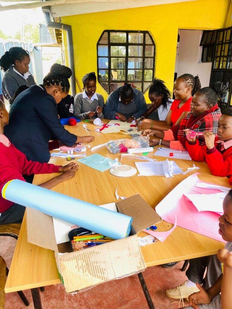 Learners actively participating in a creative arts and design lesson at Holmeside School Kenya