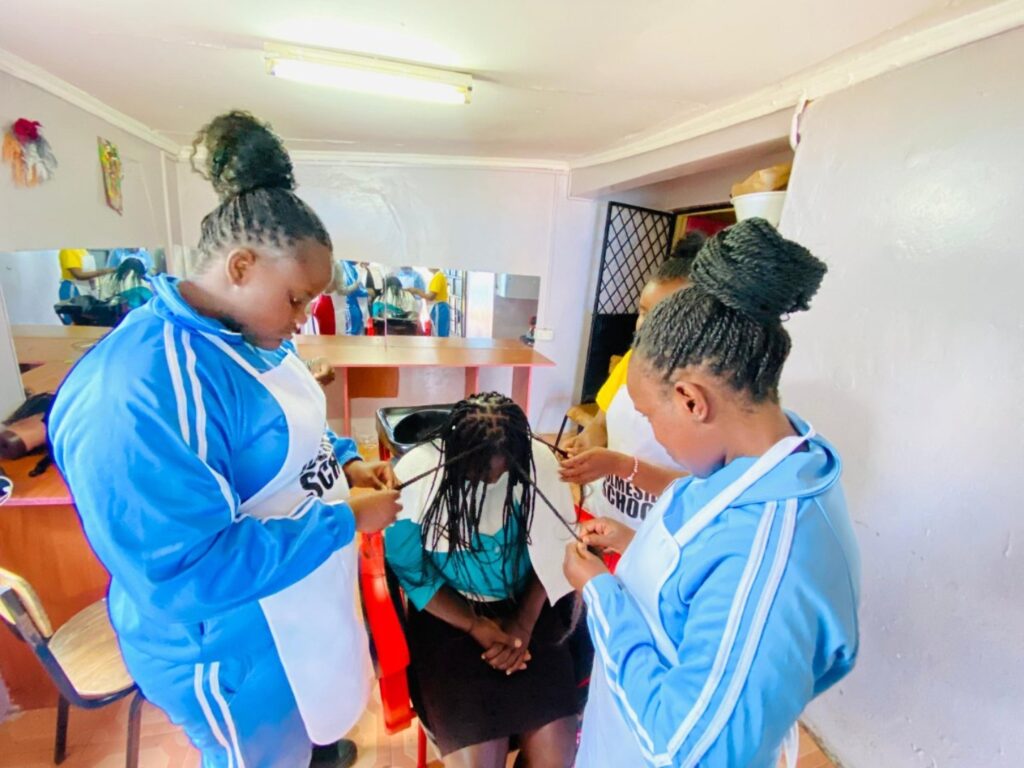 Students participating in a hair & beauty session at Holmeside School Nairobi Kenya